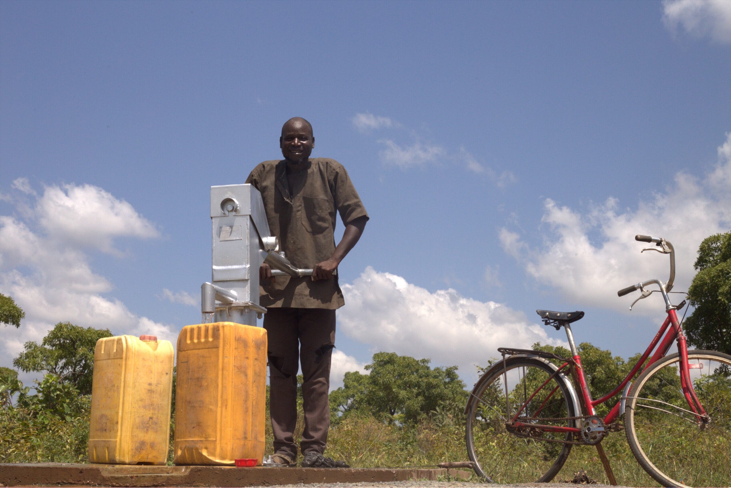 53year old man Kimikyi with gallons fetching water.